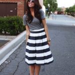 Wear gray with a black and white striped skirt like this .