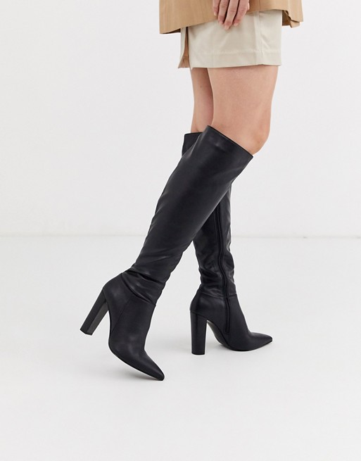 ASOS DESIGN Coral heeled knee high boots in black | AS