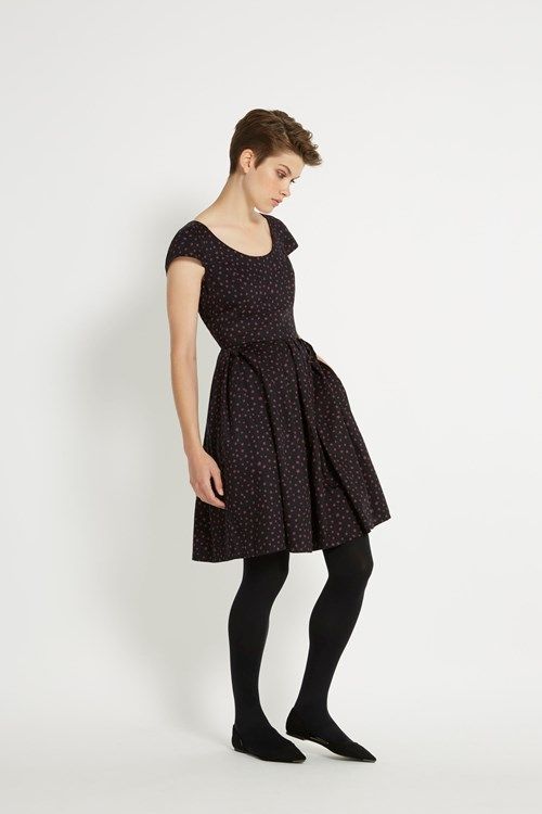 Scoop neck dress with short-sleeves and flared skirt. Wear this .