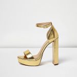 Gold metallic upper Double strap design Buckled ankle strap .