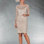 Mother Of The Bride / Groom Outfit: Knee length cream lace dress .