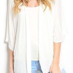 Our White Draped Short Sleeve Cardigan is 97% RAYON 3% SPANDEX .