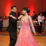 This bride and groom celebrate at their Indian wedding reception .