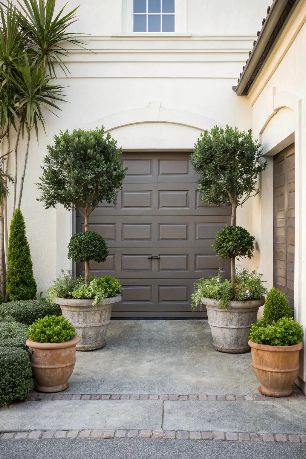 The placement of symmetrical plant arrangements lends a sense of equilibrium to the entrance of the garage.