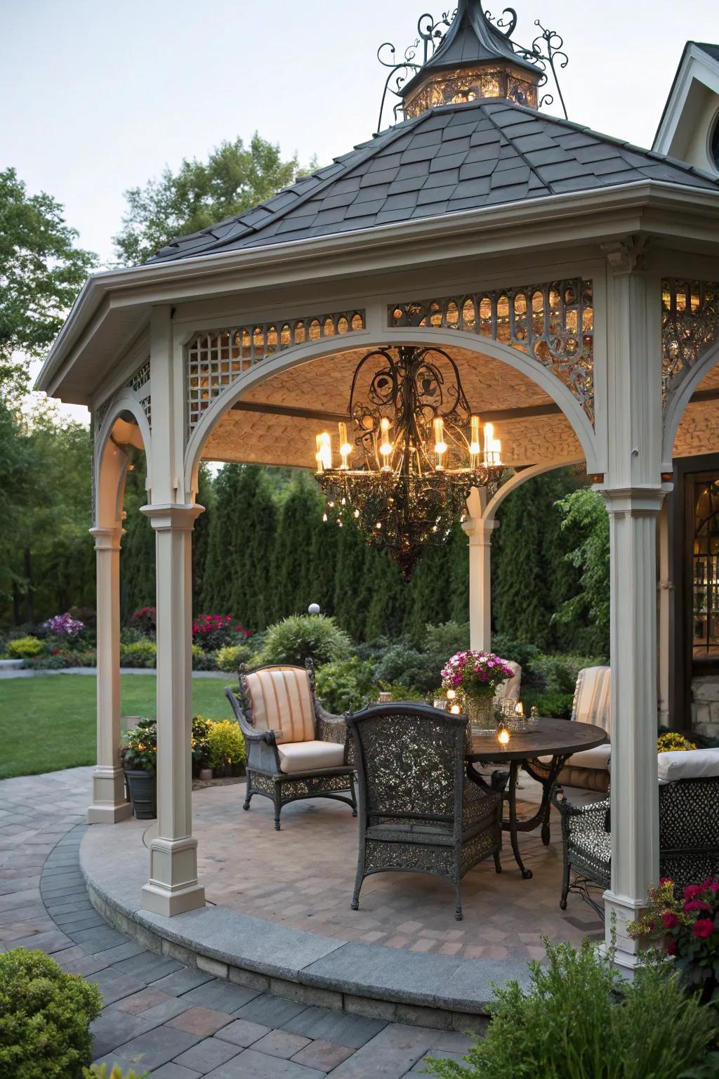 A house-like gazebo with a chandelier adding luxury to your backyard.