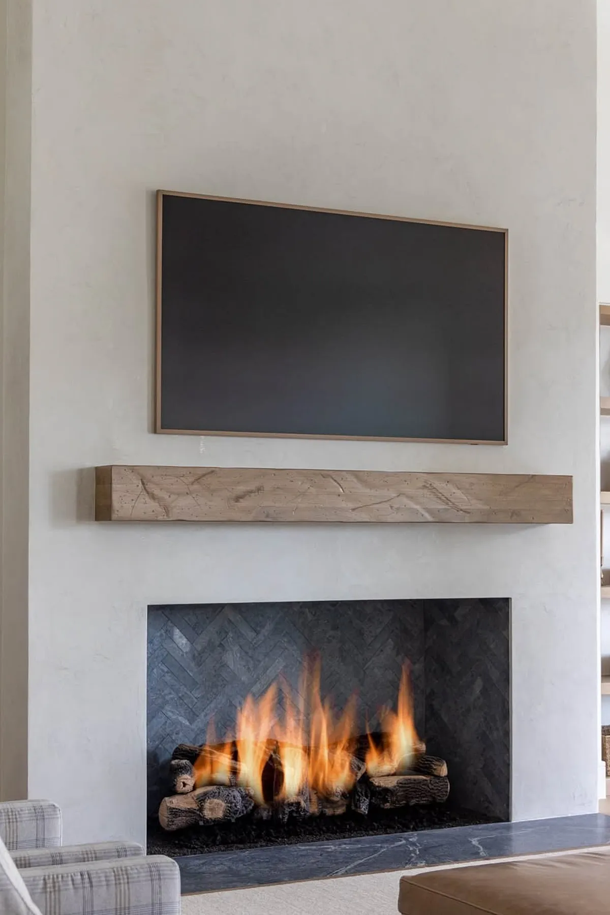 Neutral minimalist living room with tiled fireplace and tv
