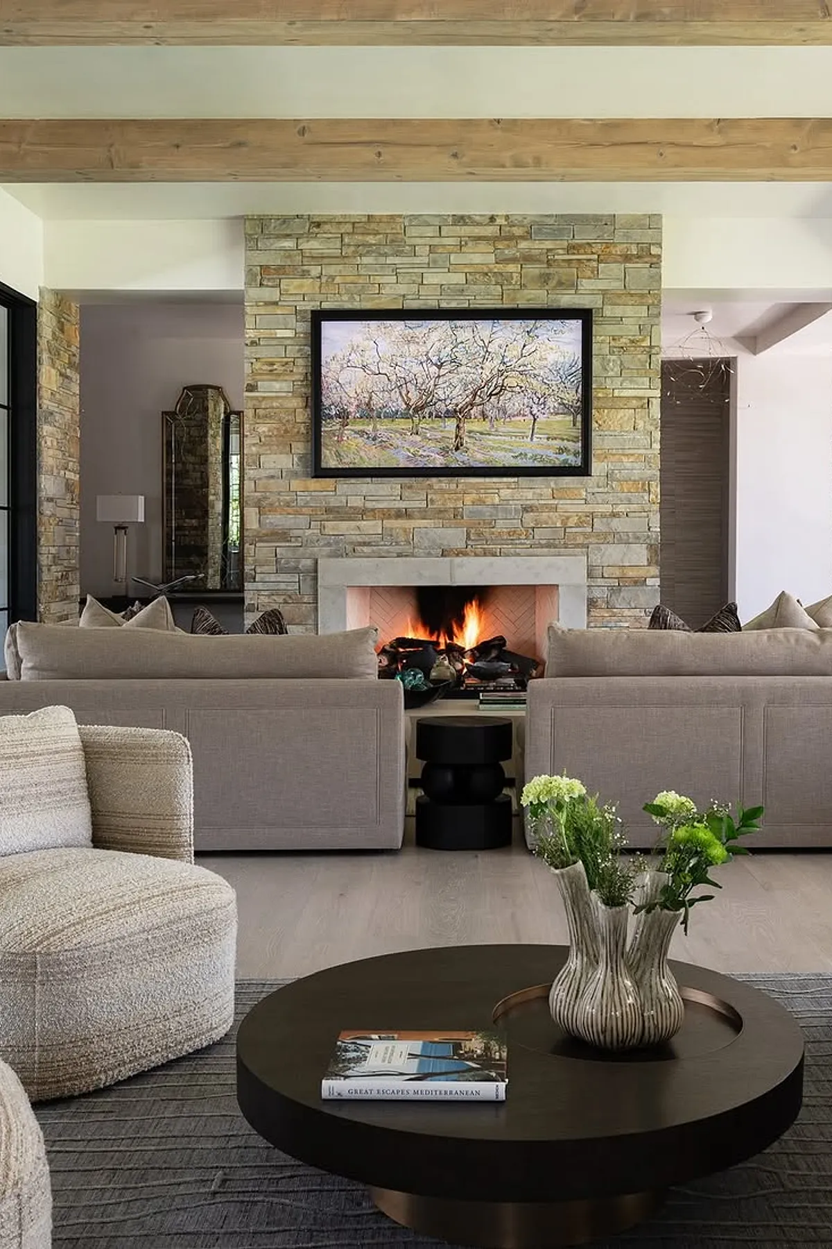 Modern rustic style living room with fireplace and tv on stone wall