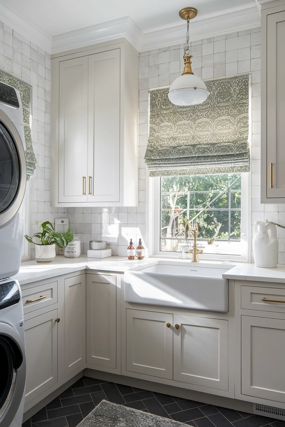 An elegant laundry room featuring neutral cabinetry, a farmhouse sink, and patterned window treatments.