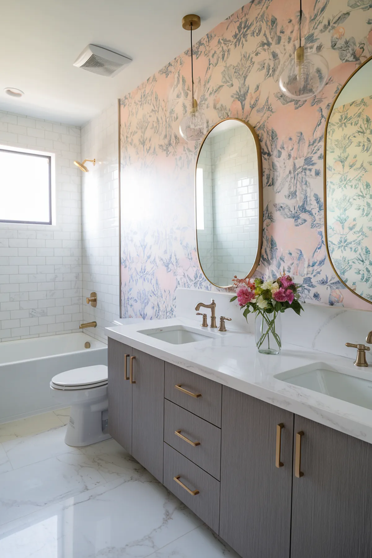 A stylish bathroom featuring floral wallpaper, dual sinks, and elegant fixtures.
