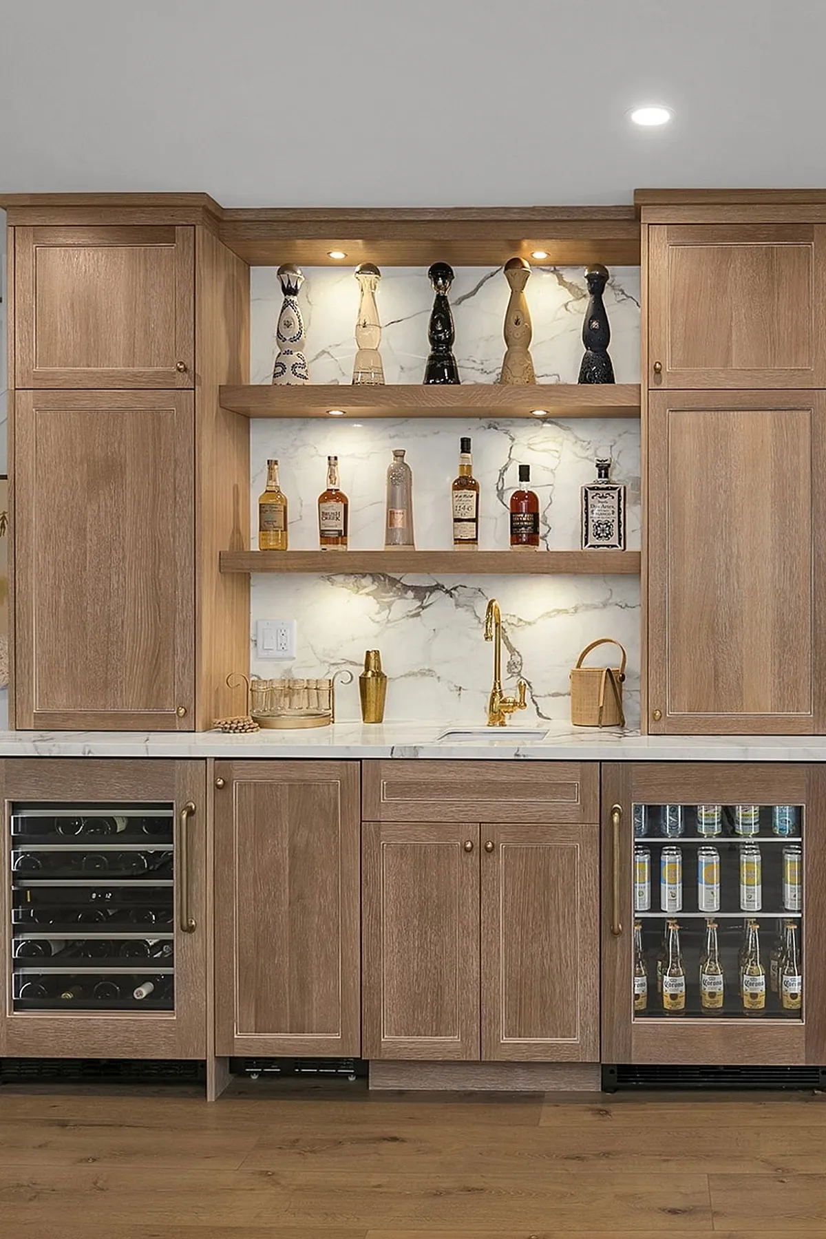 Elegant dining room featuring built-in cabinets, marble backsplash, glass shelves, and integrated wine storage.