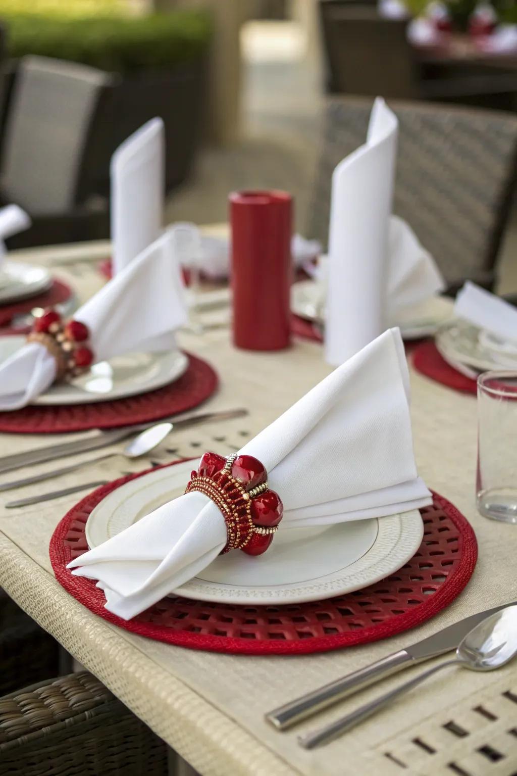 Elegant red napkin rings adding refinement to the table.