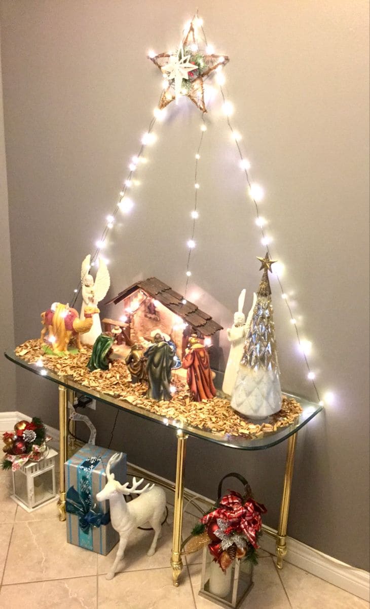 Nativity Scene Framed by Warm String Lights