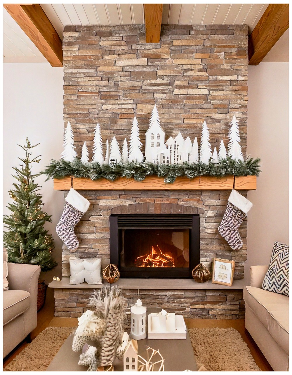 Winter village mantle using white paper houses and bottle brush trees