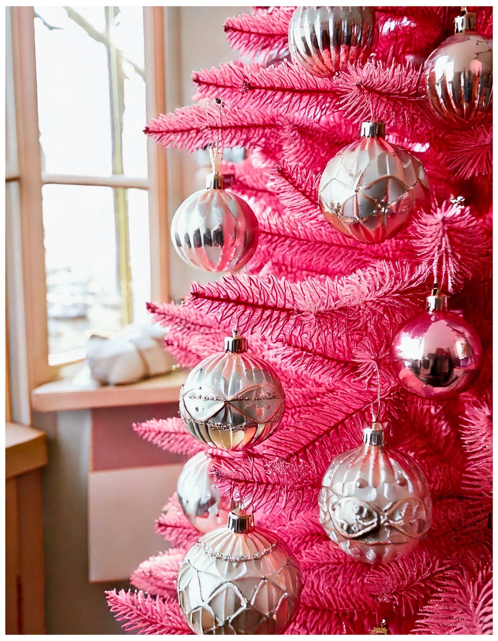 Pink Christmas tree decorated entirely with vintage glass ornaments