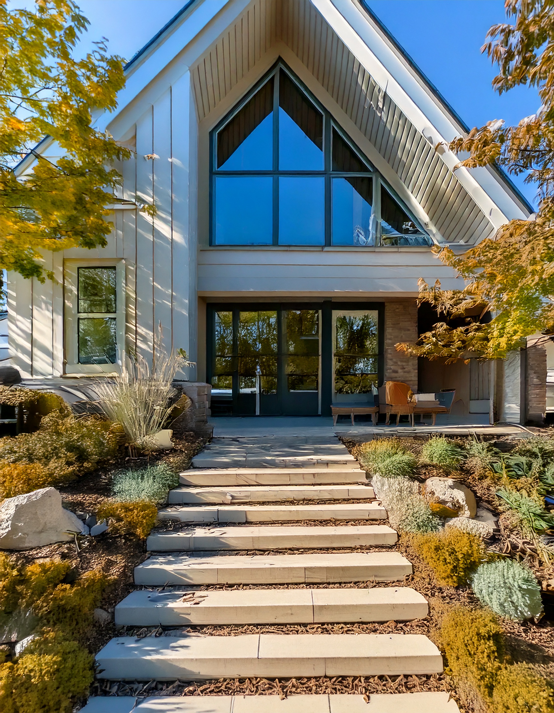 Modern farmhouse with A-frame gable and crisp white siding
