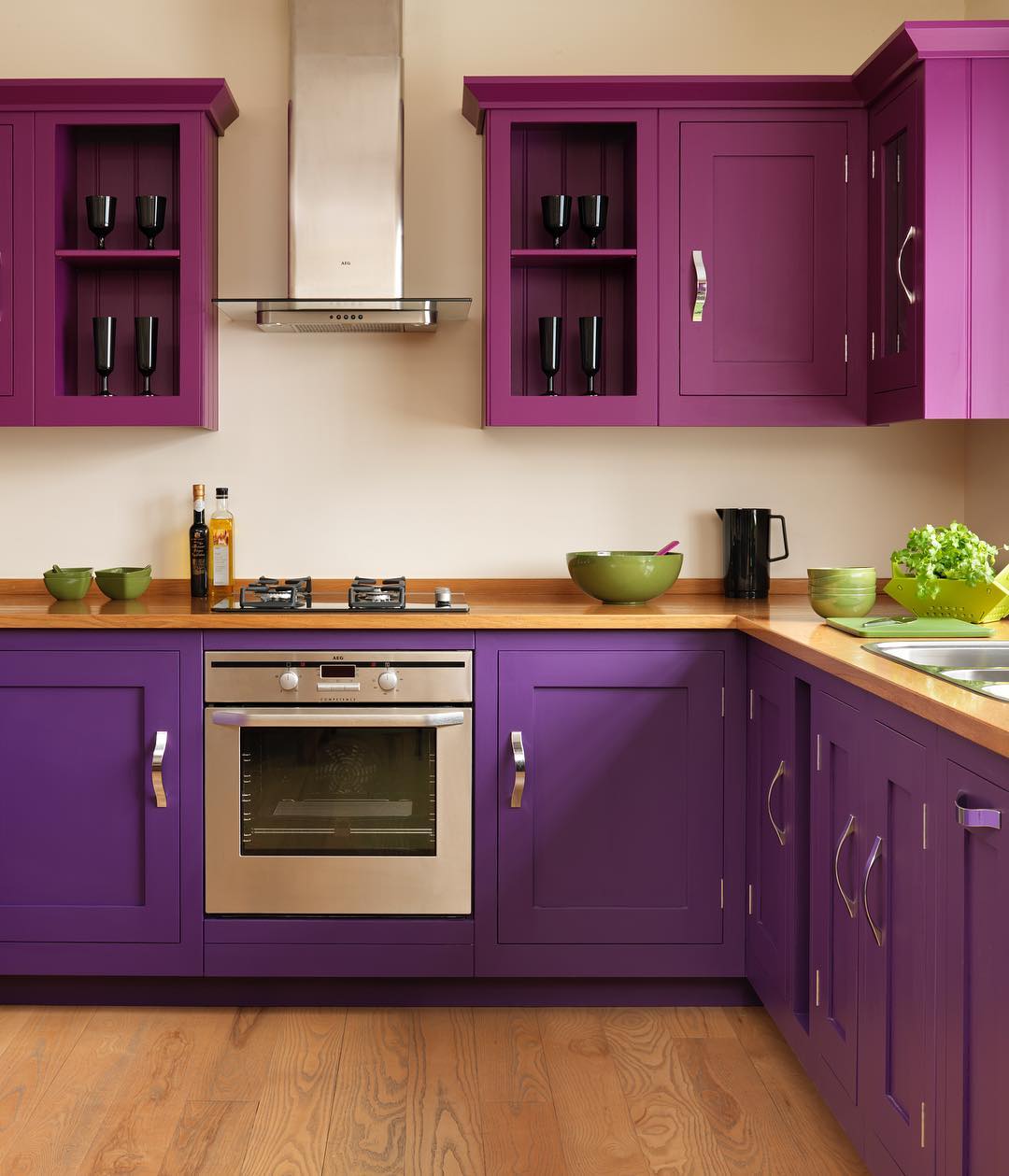 Bold Plum Cabinets With Green Accents
